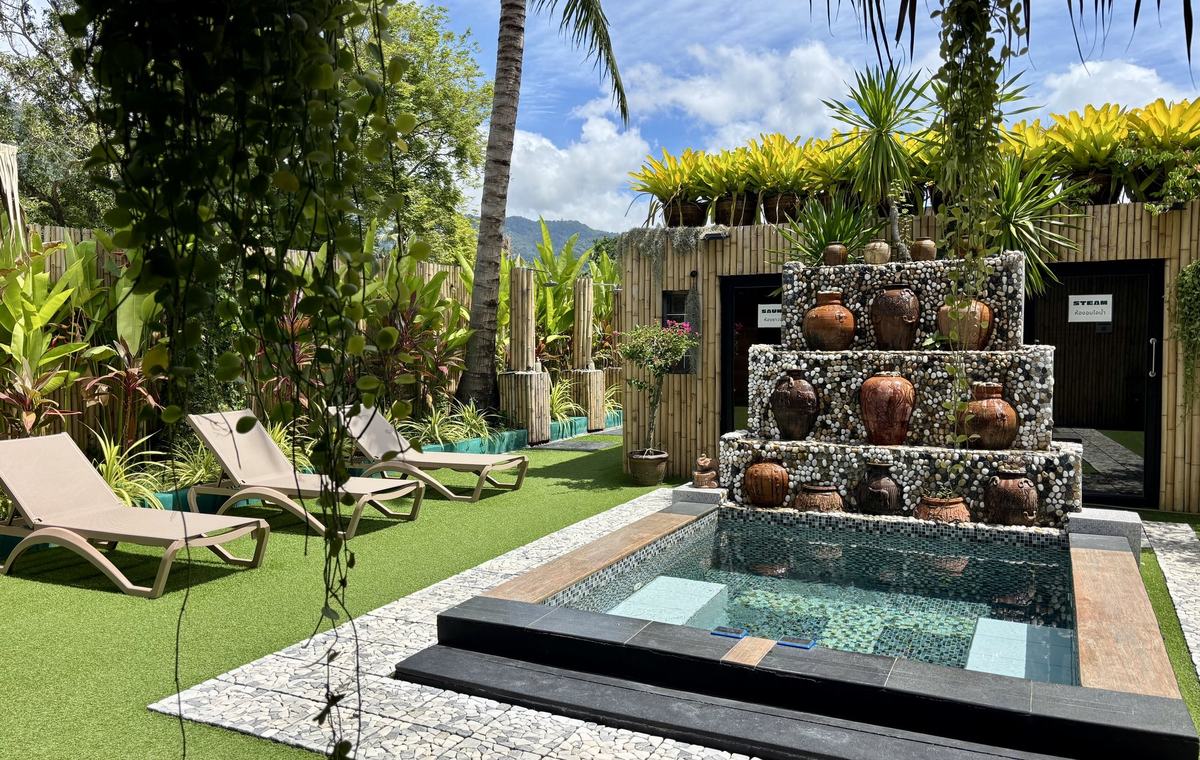 The garden circuit at Vihara, plunge pool, ceramic jar fountain, sauna and steam room doors