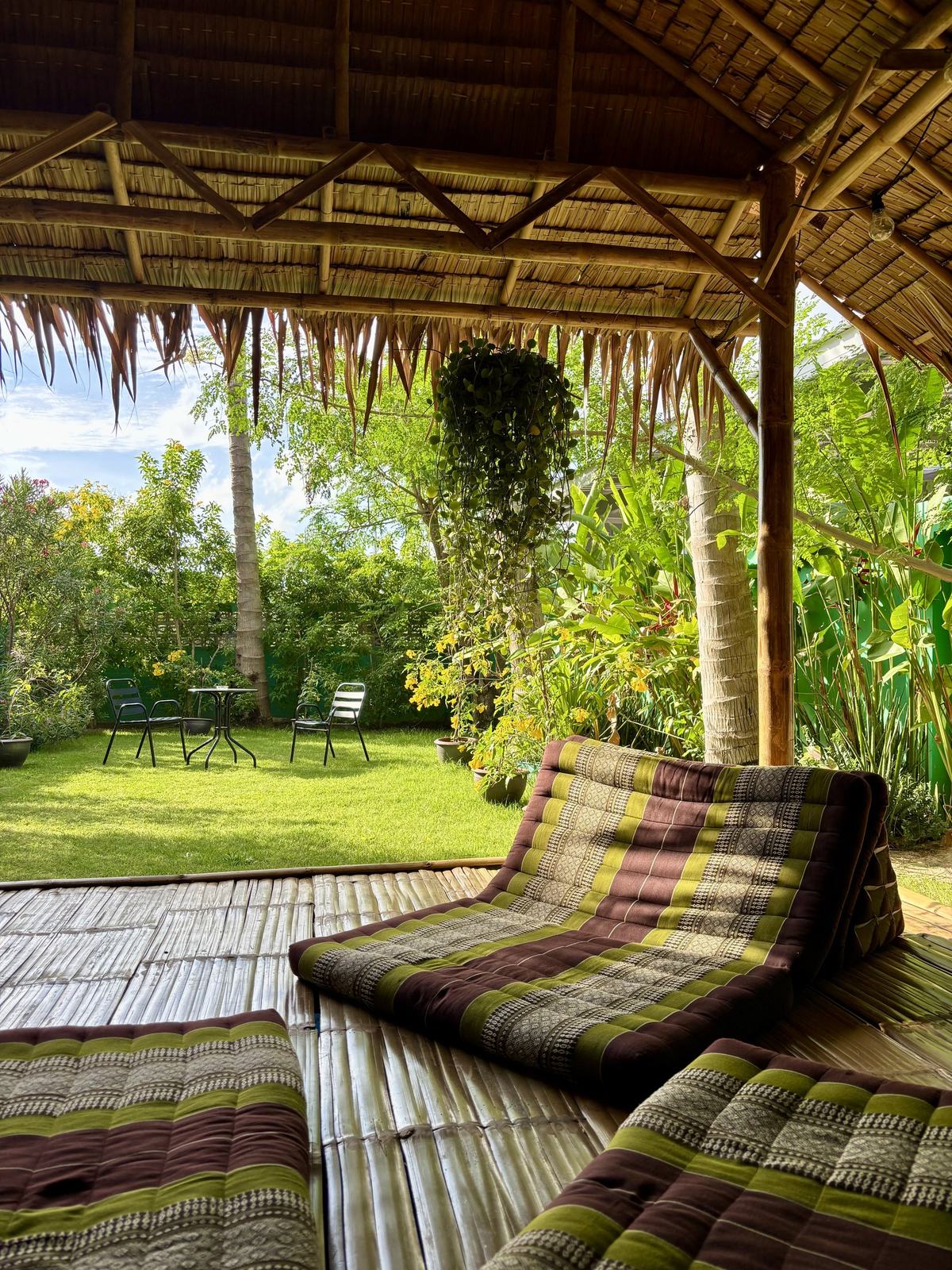 Thai cushions in the bamboo sala looking out over the garden at Vihara